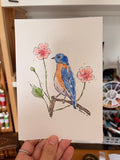 Dessin oiseau bleu et orange avec des fleurs roses