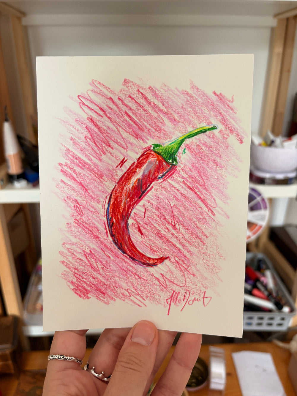 Dessin d'un piment sur un fond rose